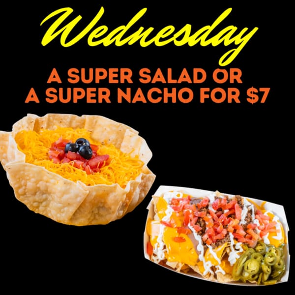 Taco salad in a fried bowl and loaded nachos, advertising a Wednesday $7 deal.